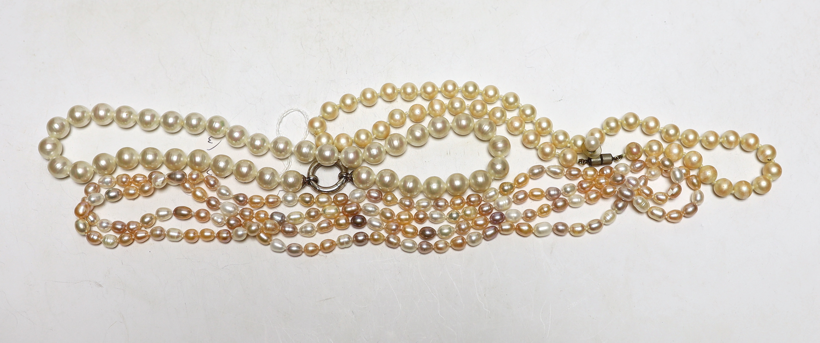 Three assorted single strand cultured South Sea pearl necklaces, largest 136cm.